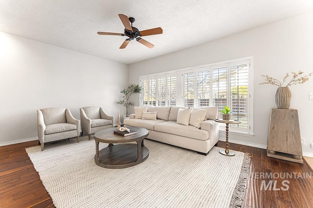 1472 N Watson Ave, Eagle, ID 83616 - living room featuring a ceiling fan, baseboards, wood finished floors, and a textured ceiling