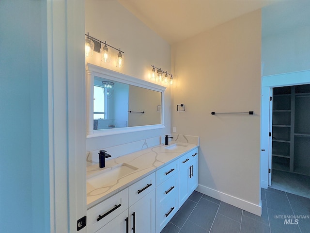 bathroom featuring tile patterned floors and vanity