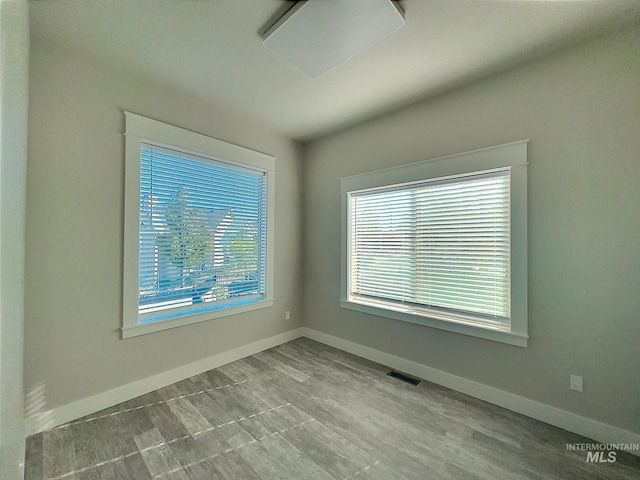 unfurnished room featuring light hardwood / wood-style floors