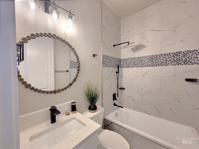 full bathroom with tiled shower / bath combo, toilet, and vanity