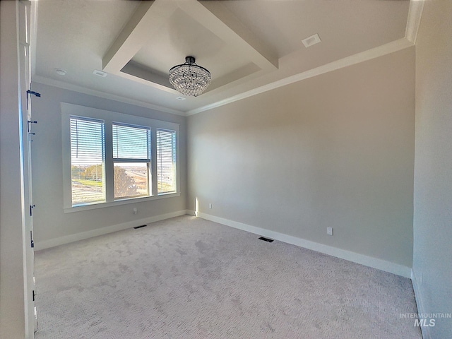 empty room with a chandelier, light colored carpet, and ornamental molding