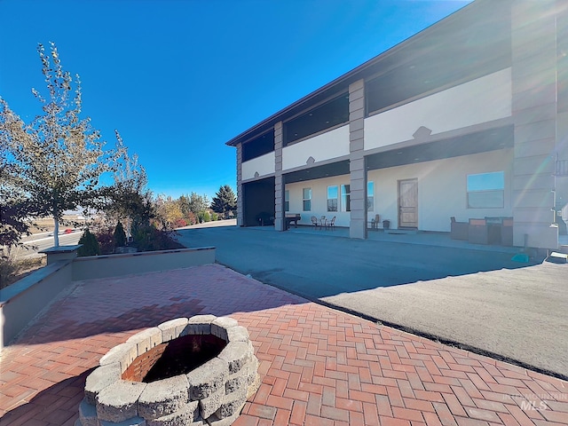 view of pool featuring a patio area and an outdoor fire pit