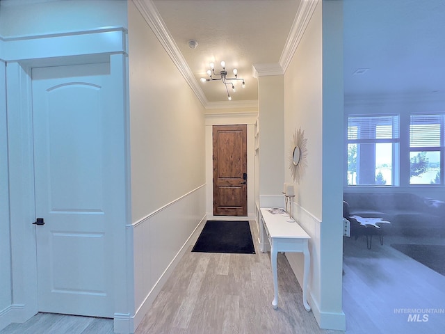 interior space with light wood-type flooring and ornamental molding