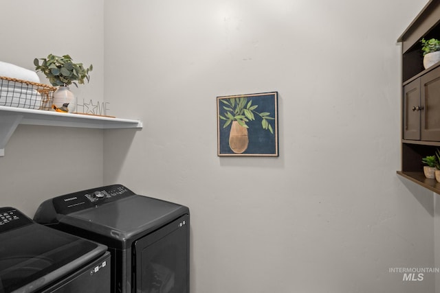 washroom with washer and dryer