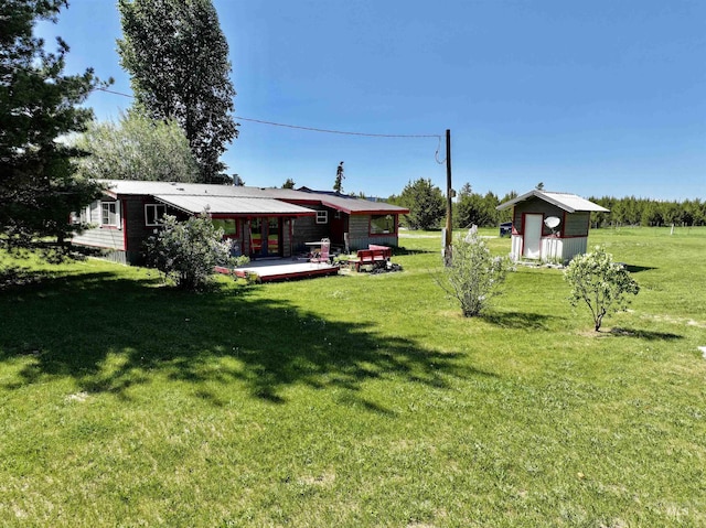 22 Flemming Ln, Mccall, ID 83638 - view of green lawn featuring french doors and an outbuilding