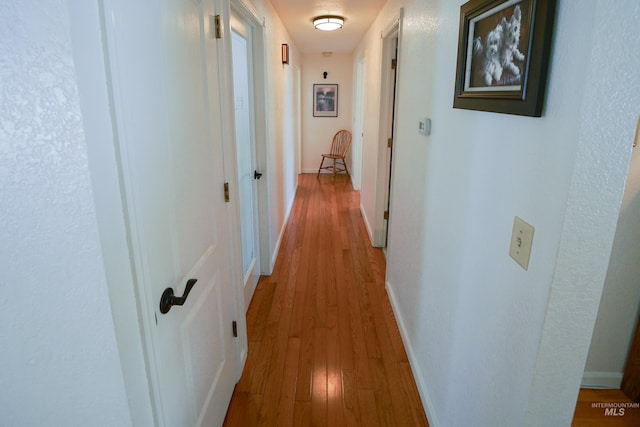 506 Fair Ln, Nampa, ID 83686 - hallway with baseboards and wood-type flooring