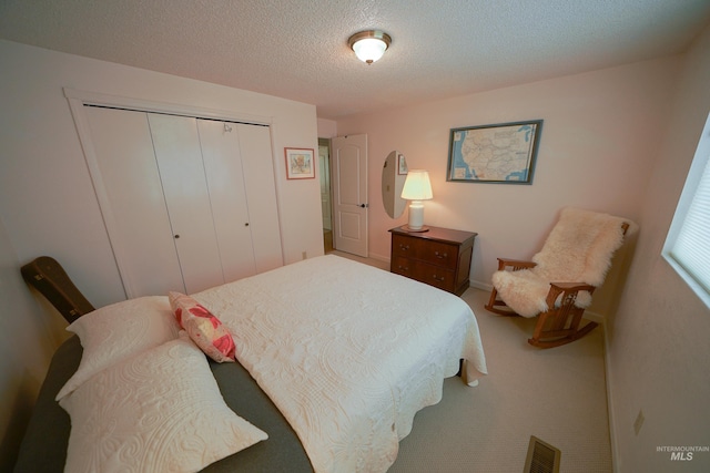 506 Fair Ln, Nampa, ID 83686 - carpeted bedroom featuring a closet, visible vents, and a textured ceiling