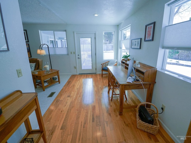 506 Fair Ln, Nampa, ID 83686 - entryway featuring light wood-type flooring, baseboards, a textured ceiling, and visible vents