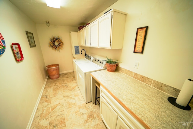 506 Fair Ln, Nampa, ID 83686 - washroom with baseboards, cabinet space, and washing machine and clothes dryer