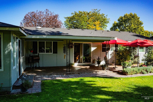 506 Fair Ln, Nampa, ID 83686 - back of property with a patio area and a lawn