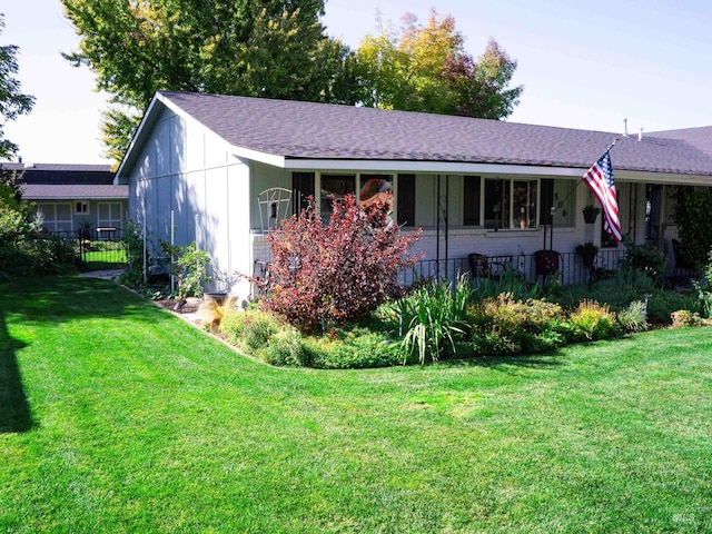 506 Fair Ln, Nampa, ID 83686 - view of front of property featuring brick siding, a front yard, and fence