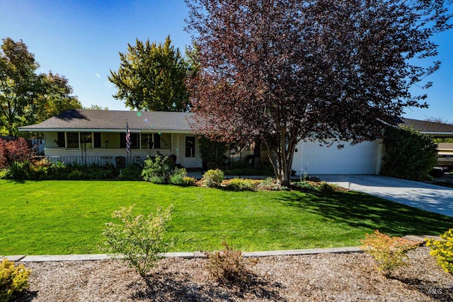506 Fair Ln, Nampa, ID 83686 - view of front facade featuring a garage, a porch, concrete driveway, and a front yard