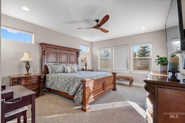 bedroom featuring ceiling fan and light colored carpet