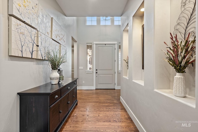 hall with wood-type flooring