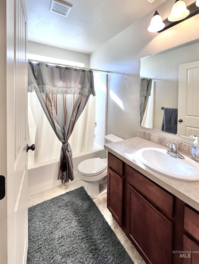 full bathroom featuring tile patterned floors, shower / bath combo, toilet, and vanity