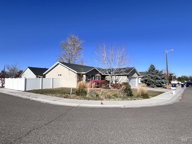 ranch-style home featuring a garage