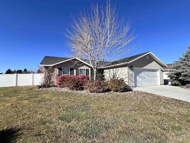 single story home featuring a garage and a front yard