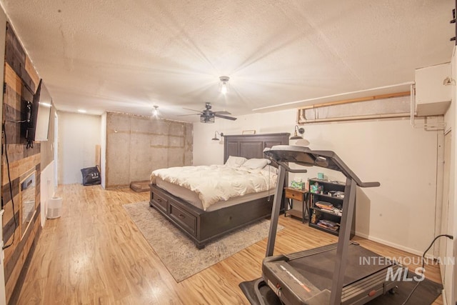 3132 8th St Unit C, Lewiston, ID 83501 - bedroom with wood finished floors, a textured ceiling, and ceiling fan