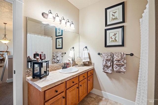 bathroom featuring vanity and a textured ceiling