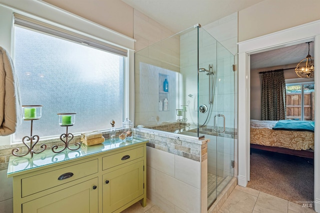 bathroom with tile patterned floors and a shower with door