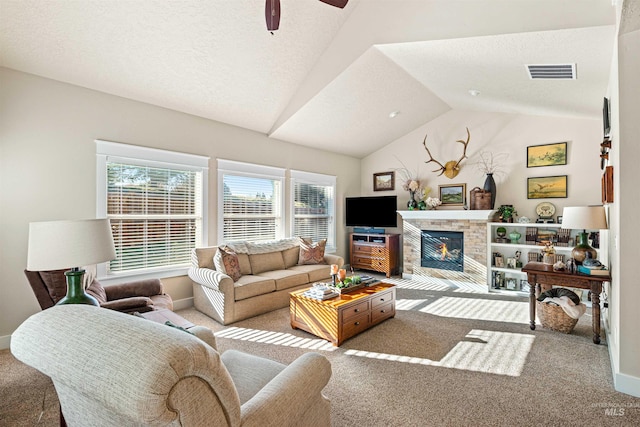 carpeted living room featuring a textured ceiling, vaulted ceiling, and ceiling fan