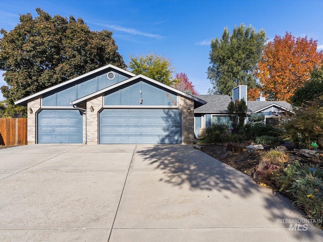 ranch-style house featuring a garage