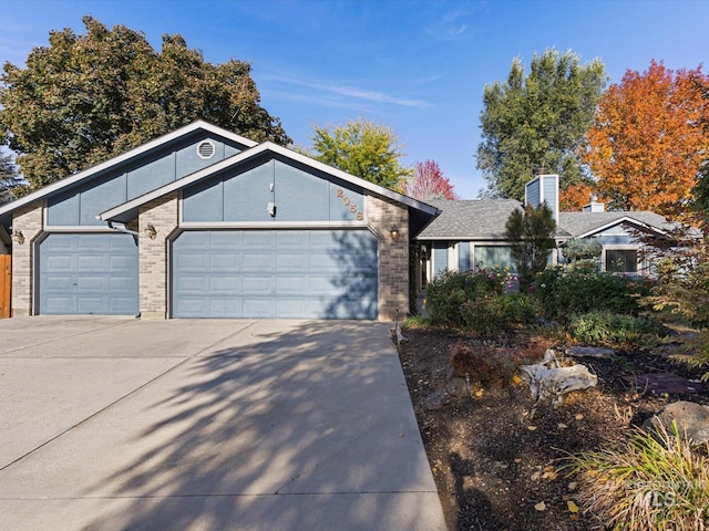 ranch-style house featuring a garage