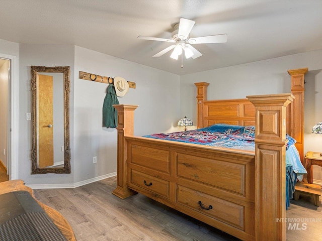 bedroom featuring light wood-type flooring and ceiling fan