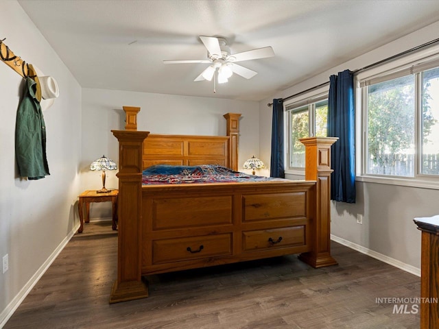 bedroom featuring ceiling fan and dark hardwood / wood-style floors