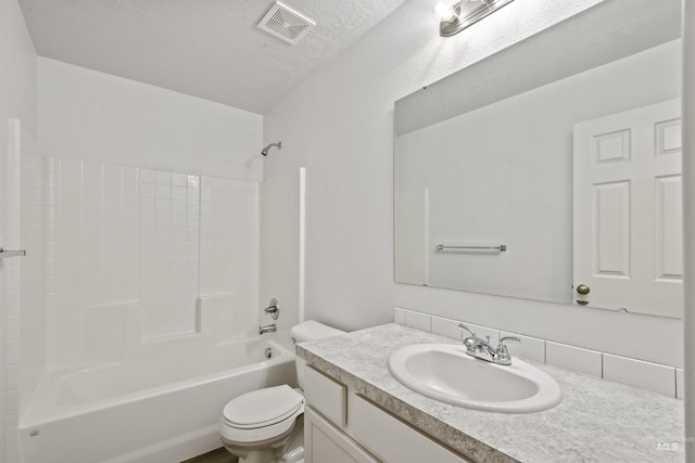 full bath with visible vents, toilet, vanity, a textured ceiling, and  shower combination