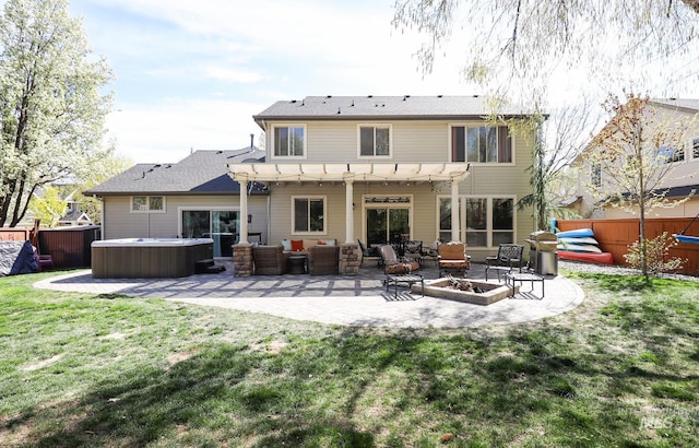 rear view of property featuring a lawn, a patio area, a hot tub, fence, and a pergola