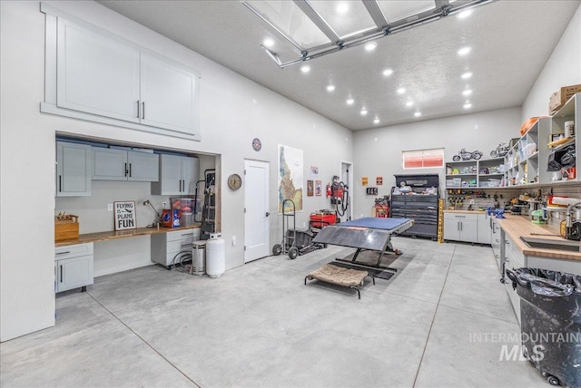 3800 Birch Ln, Emmett, ID 83617 - garage featuring a workshop area and recessed lighting