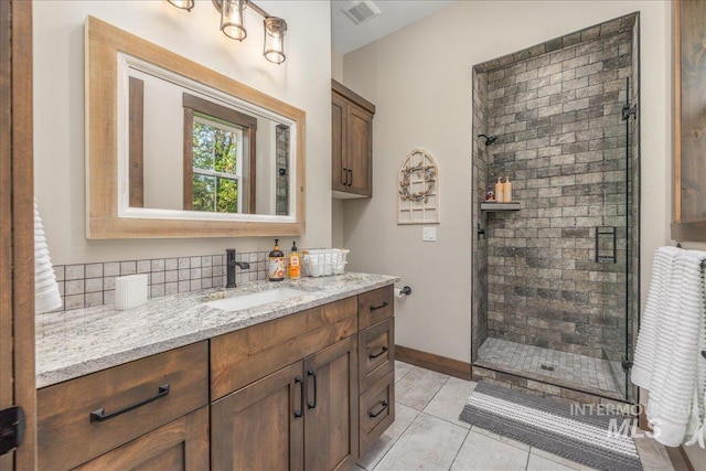 3800 Birch Ln, Emmett, ID 83617 - full bathroom with a stall shower, vanity, baseboards, and tile patterned flooring