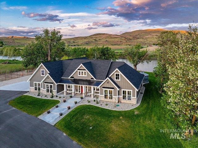 3800 Birch Ln, Emmett, ID 83617 - craftsman inspired home with board and batten siding, covered porch, a mountain view, and a shingled roof