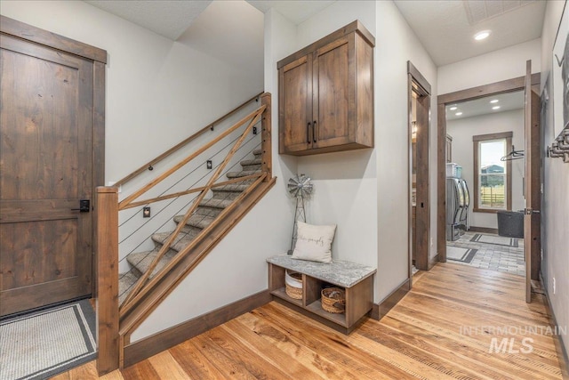 3800 Birch Ln, Emmett, ID 83617 - stairway featuring wood finished floors, washer / dryer, recessed lighting, and baseboards