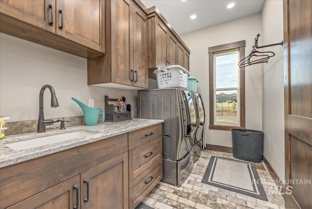 3800 Birch Ln, Emmett, ID 83617 - laundry room featuring washer and dryer, cabinet space, brick patterned floors, recessed lighting, and baseboards