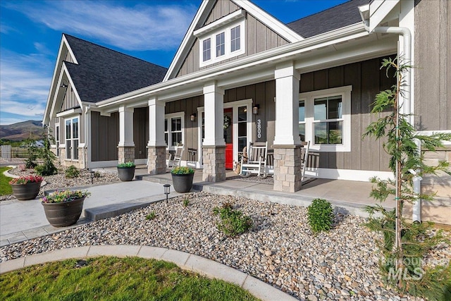 3800 Birch Ln, Emmett, ID 83617 - view of front of property featuring covered porch, board and batten siding, and roof with shingles