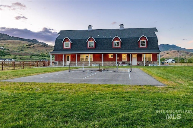 3800 Birch Ln, Emmett, ID 83617 - back of house at dusk with a mountain view and stone siding