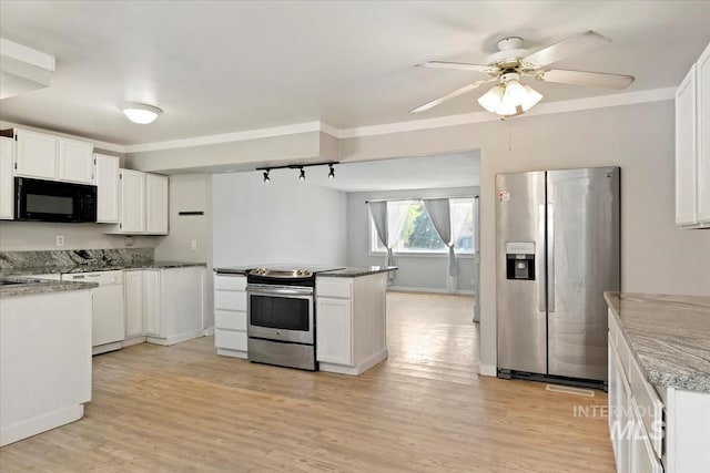 kitchen with light wood finished floors, ceiling fan, a peninsula, white cabinets, and appliances with stainless steel finishes