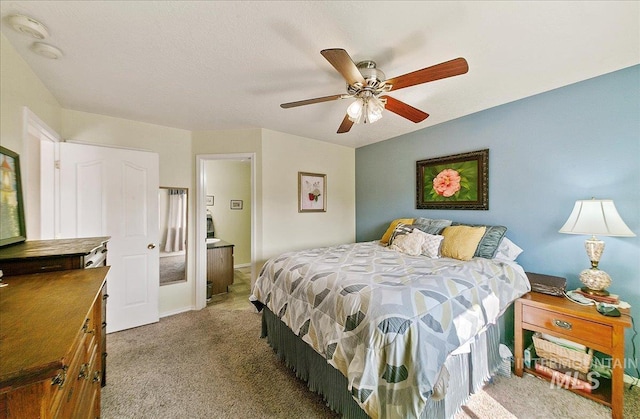 carpeted bedroom with a ceiling fan