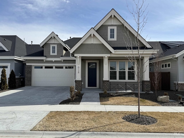 craftsman-style house featuring concrete driveway and brick siding