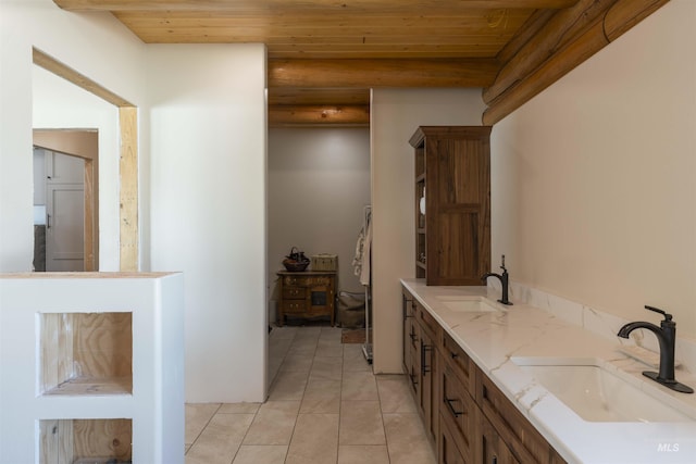 full bath with tile patterned floors, wooden ceiling, and a sink