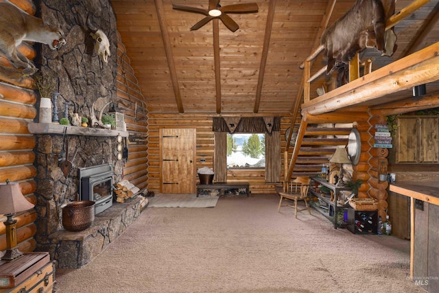 unfurnished living room featuring wood ceiling, carpet flooring, rustic walls, and a wood stove