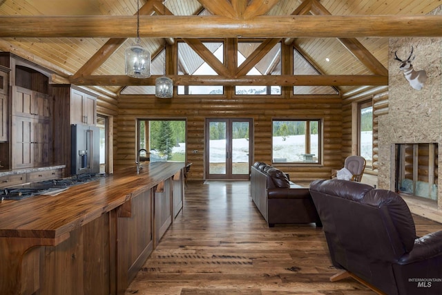 living area with beamed ceiling, french doors, high vaulted ceiling, and wood ceiling
