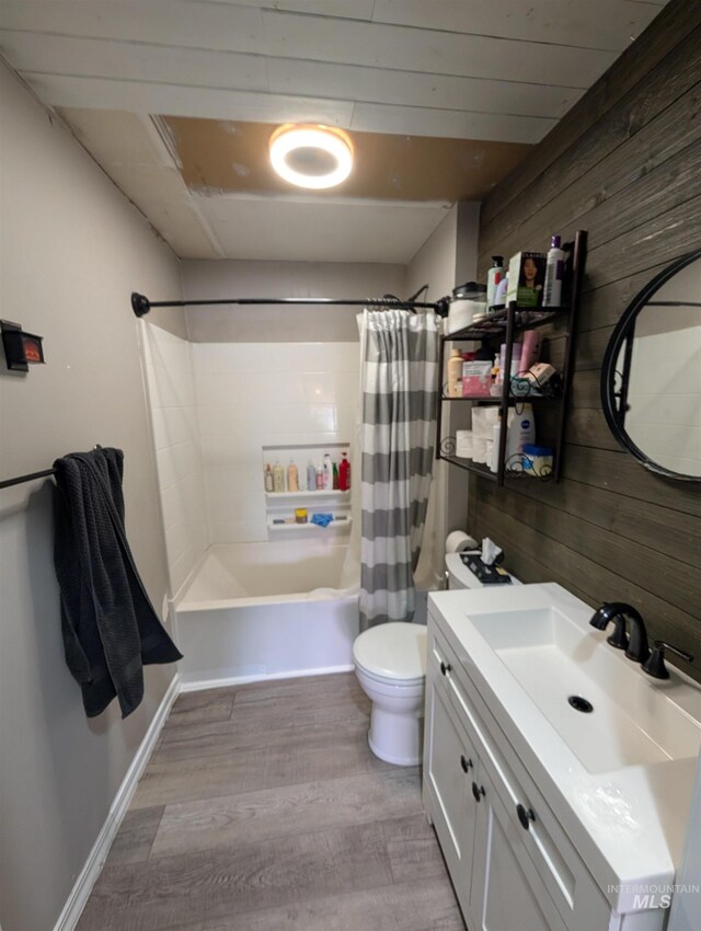 116 Main St, Stites, ID 83552 - full bath with vanity, wood walls, wood finished floors, shower / bath combination with curtain, and toilet