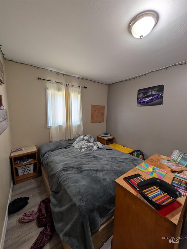 116 Main St, Stites, ID 83552 - bedroom with baseboards and wood finished floors