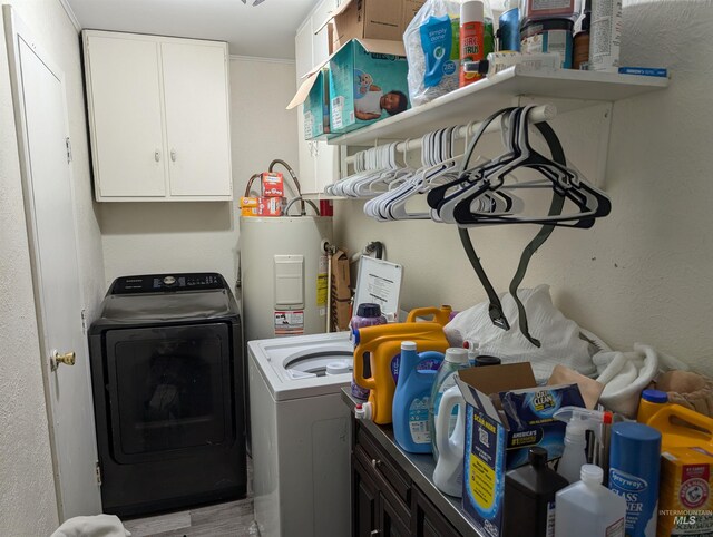 116 Main St, Stites, ID 83552 - laundry area featuring cabinet space, water heater, and washer and dryer
