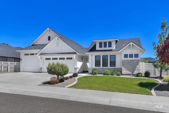 modern farmhouse style home featuring board and batten siding, stone siding, a garage, concrete driveway, and a shingled roof