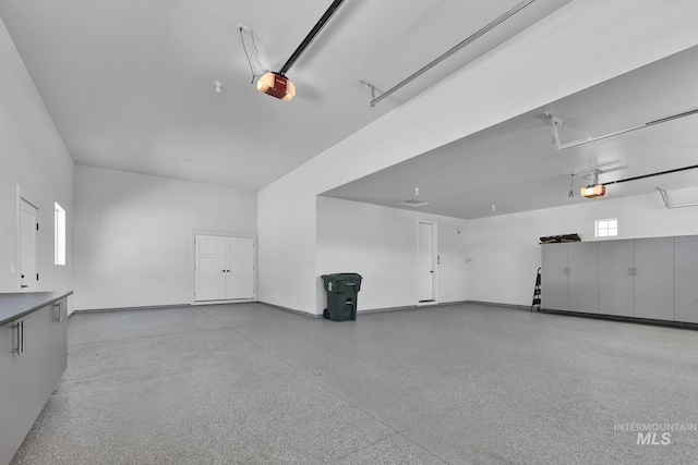 garage featuring a garage door opener