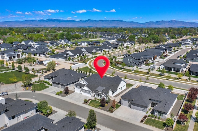 aerial perspective of suburban area featuring a mountainous background